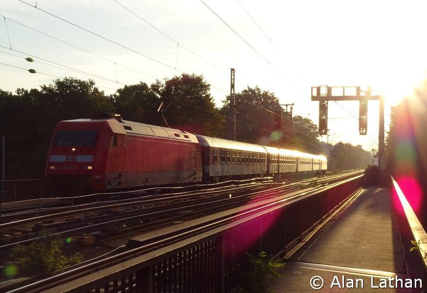 101 114 FFOR 19 July 2014
with a City Night Line (probably CNL473 to Copenhagen) direct out of the sun at 6:36 a.m.
